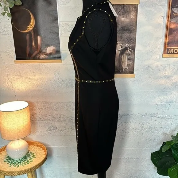 Cache NWT black dress with gold tone rock studs in sz 6. Stretchy.