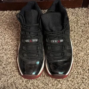 Jordan Black and Red Sneakers with Glossy Finish