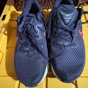 Nike Black and Pink Athletic Shoes with Mesh Upper