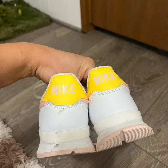 Nike Woman’s Internationalist White and Arctic Orange Sneakers