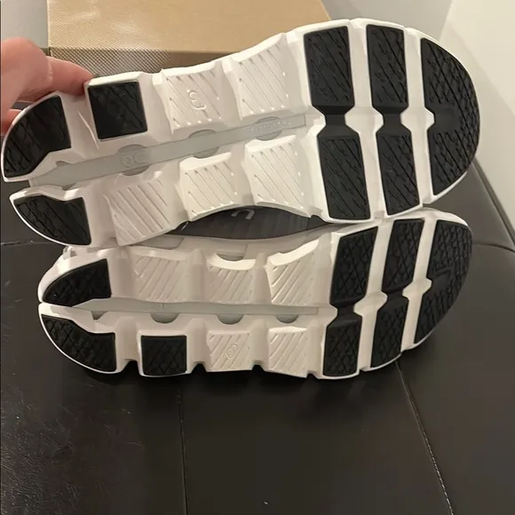 On Running Gray and White Athletic Shoes with Cloud Pods