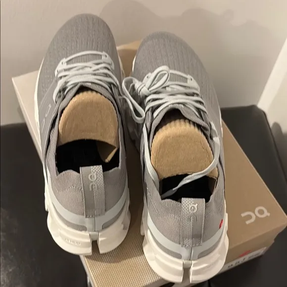 On Running Gray and White Athletic Shoes with Cloud Pods